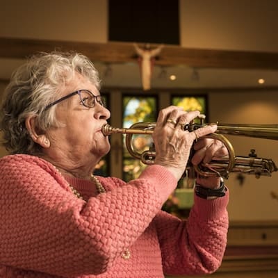 Carol playing the trumpet