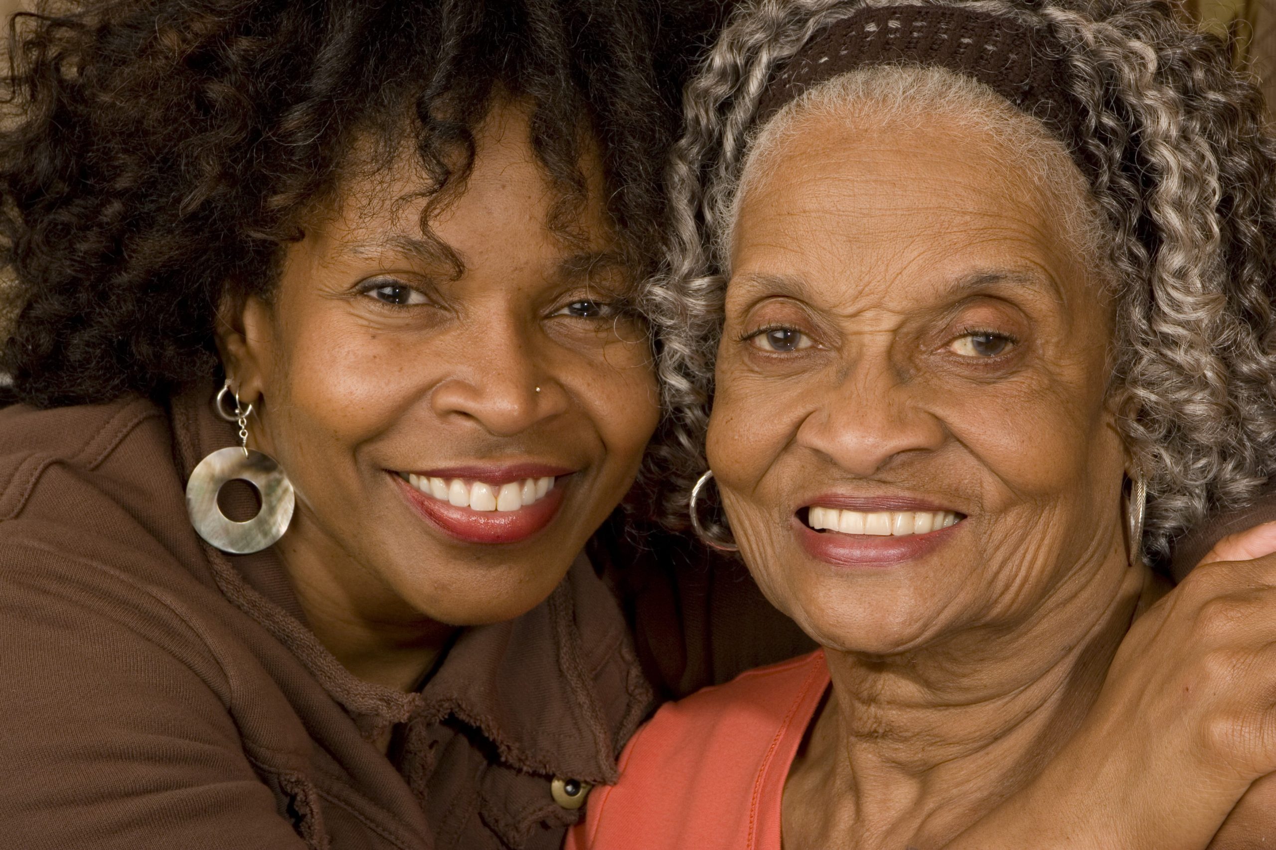 a daughter and mother smiling